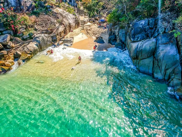Aerial view of a small turquoise cove