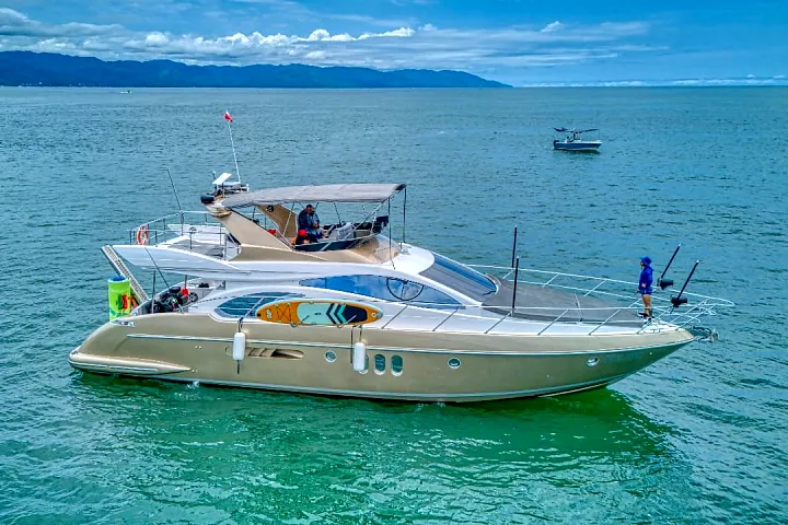 Aerial view of the Azimut 58 Fly at anchor in turquoise water