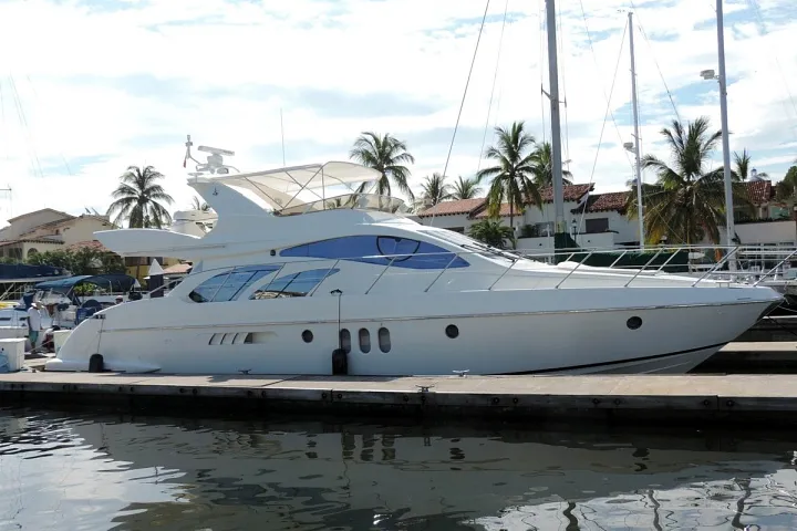 The Azimut 58 moored in a marina