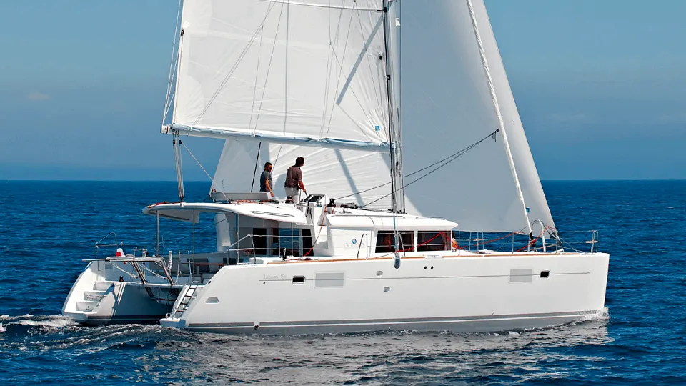 A sailing catamaran under sail on open water